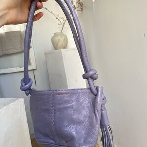 Paloma Wool lavender tassle fanny pack, used. Buttery textured leather.